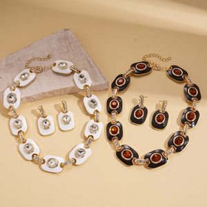 Vintage gold necklace and earring set with oval enamel inlay and sparkling crystals