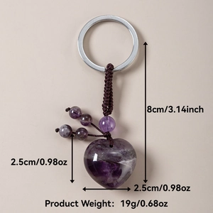 Detailed view of purple heart-shaped amethyst gemstone keychain with braided cord