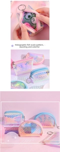 Close-up of laser fish scale pattern mini coin purses with metallic zippers and hooks
