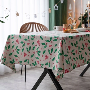 Christmas tablecloth featuring holly leaves and red berry heart print for holiday dining