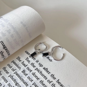 Minimalist 925 sterling silver hoop earrings with black rectangular charm on book