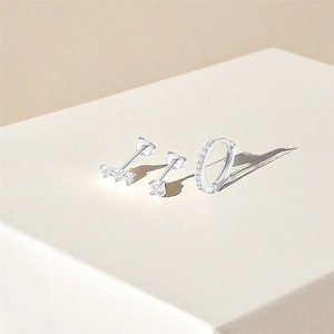 Detailed view of s925 silver earring set with turquoise and cubic zirconia accents