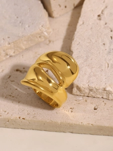 Detail of chunky 18k gold plated stainless steel ring with irregular sculptural design