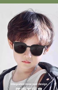 Close-up of kids foldable sunglasses showing integrated nose pads and sleek black frames
