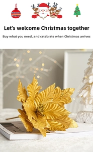 Detailed close-up of a golden artificial poinsettia with glitter on a white table surface