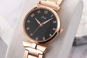 Detail of Rose Gold Stainless Steel Watch Strap and Black Dial with Tadi Branding