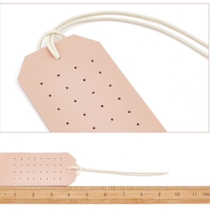 Pink PU leather earring organizer detail showing hole texture and 4.5 inch size scale