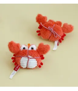 Detailed front and back view of a plush crab catnip toy with orange fur and cotton rope