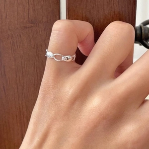 Detail of 925 sterling silver irregular chain link ring worn on index finger