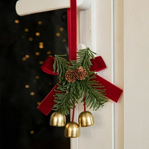 Christmas velvet red bow hanging ornament with pine cones and golden bells decoration