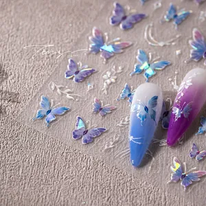 Macro detail of iridescent butterfly nail art stickers with purple gradient and gold accents