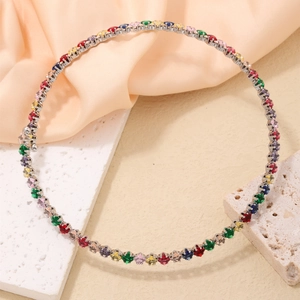 Macro shot of colorful square-cut zircon necklace on elegant silk background