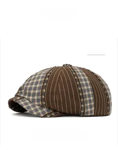 Detail view of coffee-colored contrast beret cap with patchwork stripe and plaid patterns