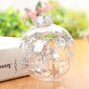 Detail of 8cm clear Christmas ball filled with silver star sequins and metallic wire