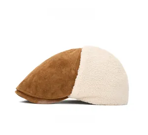 Side view of winter beret cap featuring brown suede and cream faux shearling textures