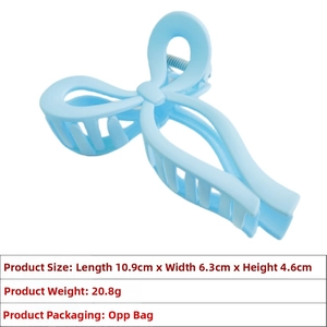 Detail view of large light blue bow hair claw with size 10.9x6.3x4.6cm and matte finish