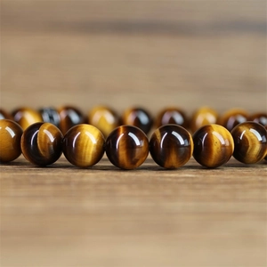Retro 8mm natural tiger eye stone bead bracelet with a micro-set zircon lion head charm