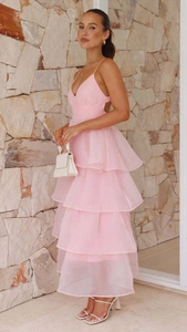 Detail view of the layered pink tulle ruffles on the backless formal evening gown