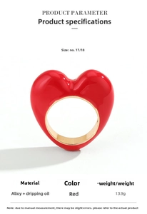 Detail view of bold red heart ring showing 13.9g weight and size parameters