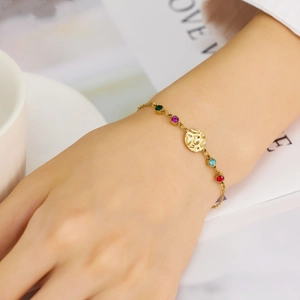 Golden stainless steel chain bracelet with colorful gemstones and hammered metal disc