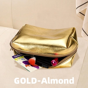 Waterproof gold-almond makeup bag with metallic PU finish on beige fabric surface