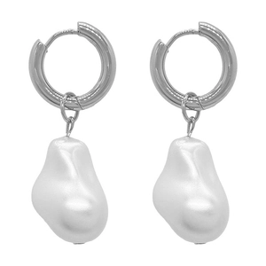Macro detail of silver baroque drop earrings featuring irregular white pearl pendants