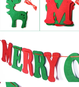 Detail of red and green felt Merry Christmas banner with reindeer shapes for holiday decor