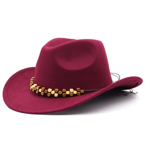 Detail of burgundy wool western cowboy hat featuring ethnic style wooden beaded band decor