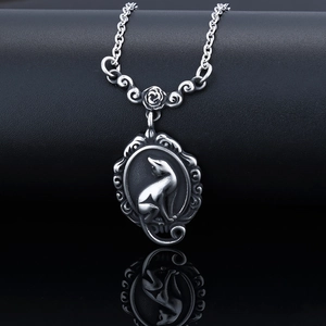 Detailed close-up of a vintage silver cat cameo pendant with 3D rose floral connector