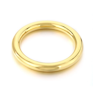 Polished gold hollow tube bangle made of stainless steel shown on a clean white background