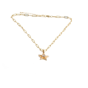 Close-up of gold star pendant with square cubic zirconia and sparkling pave border