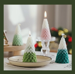 Macro detail of Christmas tree candles with gradient colors and embossed leaf textures