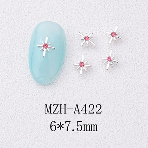 Detailed view of silver alloy star nail charms with pink crystal, size 6x7.5mm