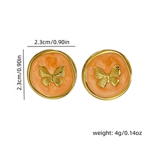Detailed view showing the 2.3cm diameter of the orange enamel butterfly stud earrings