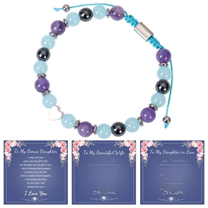 Detail of beaded bracelet with heart charm and three English message gift cards
