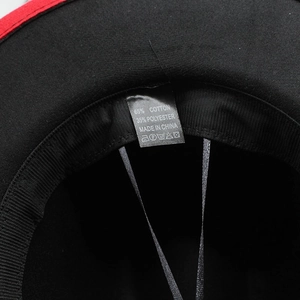 Detailed view of the fedora hat label showing 65% cotton and 35% polyester material