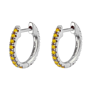 Detail of silver huggie earrings with yellow zircon and 14K gold hallmark engraving