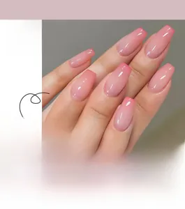 Detailed view of pink gradient French press-on nails in long coffin shape with glossy finish