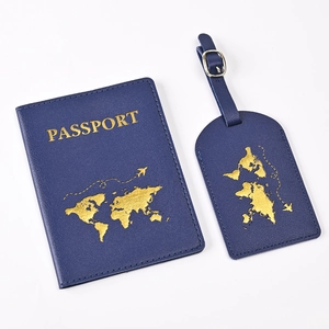 Detail view of blue PU leather passport holder and luggage tag set with gold world map