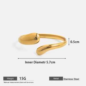 Detail view of gold stainless steel open bangle with weight and size specifications