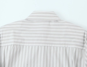 Detailed view of grey and white striped poplin shirt showing shoulder pad and collar