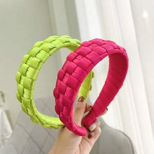 Detail of hand-woven fluorescent green and rose red satin fabric wide headbands
