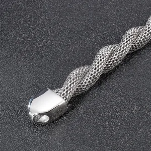 Macro detail of silver stainless steel snake chain texture and polished end cap clasp