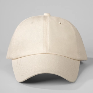 Close-up of cream cotton baseball cap showing six-panel structure and twill fabric texture