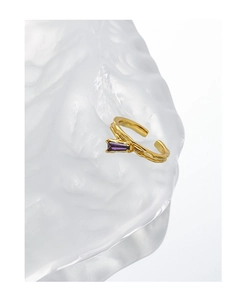 Detail of gold S925 silver ring featuring a rectangular purple zircon on ice sculpture