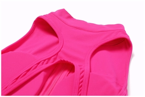 Close-up of rose red yoga jumpsuit featuring a back cutout and zipper detail