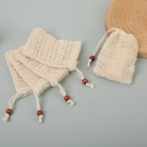 Set of four natural sisal soap saver pouches with wooden bead drawstring closure