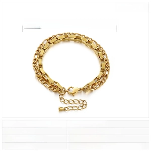 Detail of golden double-layer stainless steel bracelet showing Figaro and box chain lengths