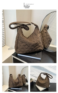 Detail of coffee-colored quilted tote bag featuring star patterns and crescent shape
