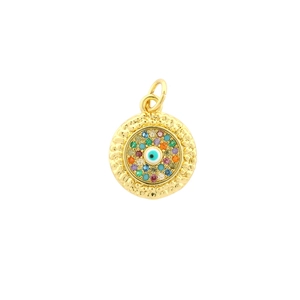 Detailed macro view of gold evil eye pendant featuring colorful zircons and hammered texture